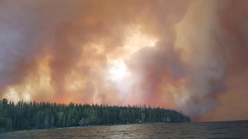 In a Facebook post Monday morning, Regina McGee Earnheart said a rescue boat took this photo of the first flames reaching historic Kelly's Camp on the north end of Lake McDonald Sunday night.