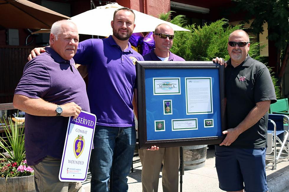 Missoula Mayor John Engen, right, accepts the city's recognition as an official Purple Heart community from members of the local chapter of the Military Order of the Purple Heart on Sunday. (Martin Kidston/Missoula Current)