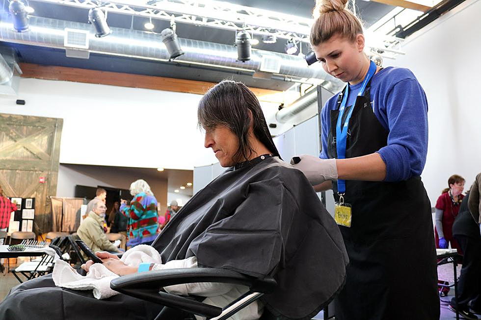 A woman gets a free haircut during Project Community Connect on Friday. The annual event is designed as a one-stop shop for the city's low-income and homeless residents. (Martin Kidston/Missoula Current)