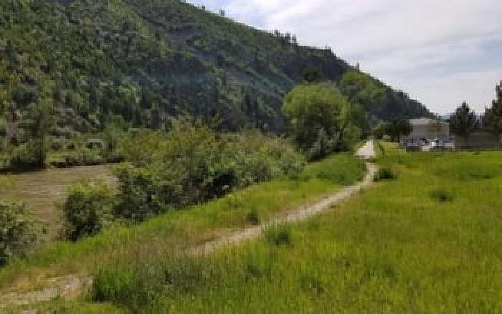 City to purchase, resell property to secure trail easement along Clark Fork River